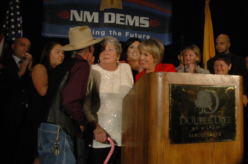 Michelle Lujan Grisham and her mother, Sonja Lujan, celebrate Lujan Grisham’s win with Lorenzo Candalaria Tuesday, Nov. 4, 2014, at the Doubletree Hotel in Downtown Albuquerque. Grisham won the race for Congress 58% to 41% against the Republican candidate Michael Frese. (Emily Ediger/NM News Port)