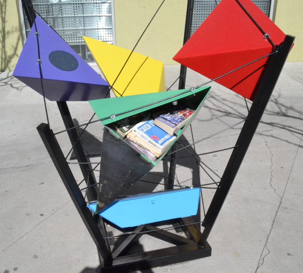 One example of the Little Free Library was built earlier this year outside of the Talin Market. This design, done by Erica Aragon, won first place in UNM's School of Architecture library design contest. Photo by Derrick Toledo / NM News Port
