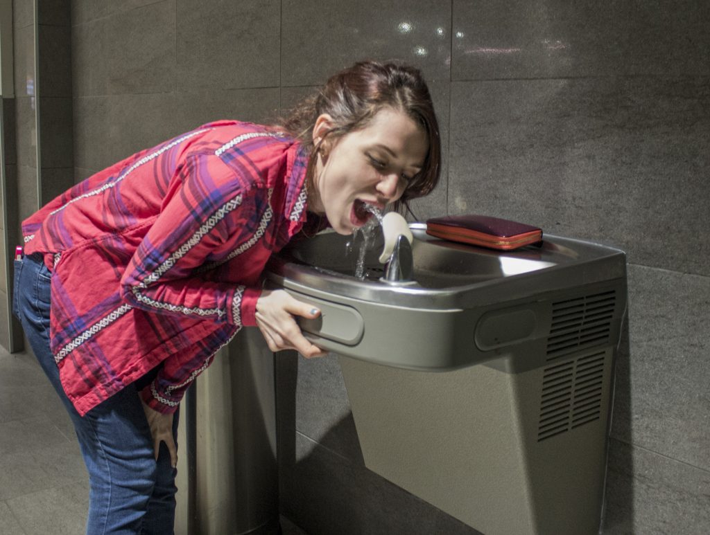  “Water fountain Lang”                                                                               Photo by Evan Barela Hannah Lang drinks from a fountain carrying water from the Albuquerque Bernalillo County Water Utility Authority. 