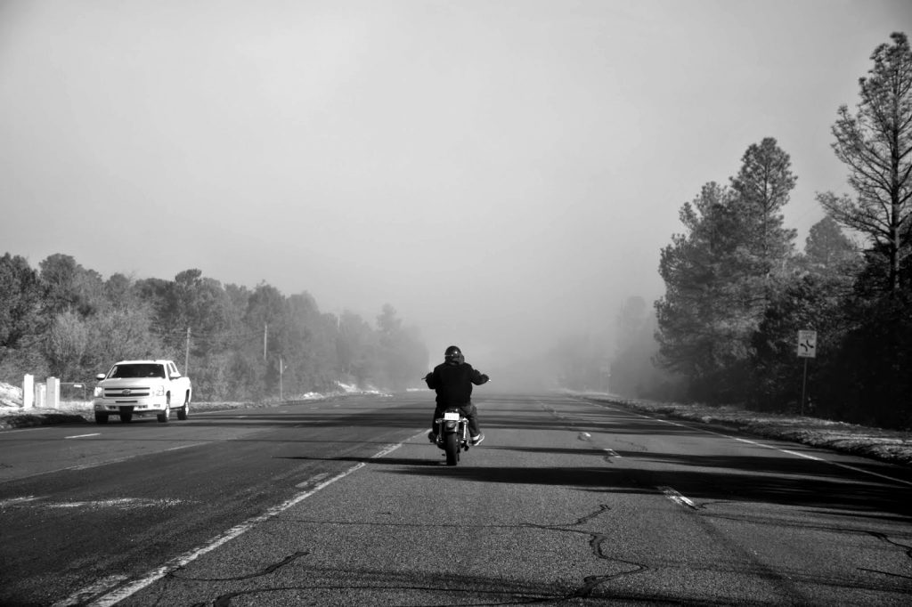 Nick Fojud rides into the early morning fog towards Madrid, NM Sunday, Feb. 1, 2015. Photo by Emily Ediger / NM News Port