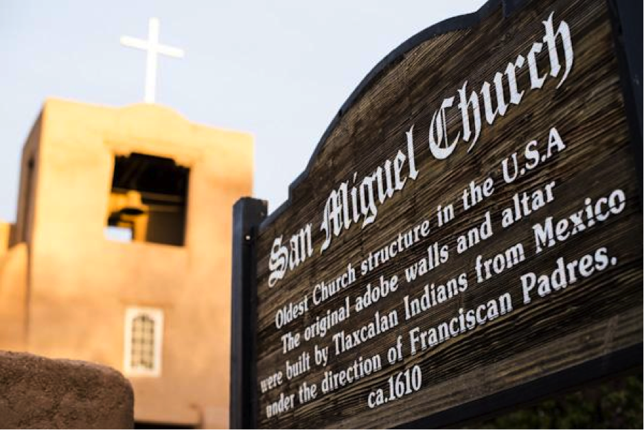 The sign of the San Miguel By Nick Fojud Church, describing the mission as not only the oldest in the state, but the oldest in the U.S. Sunday April 12. Photo. 