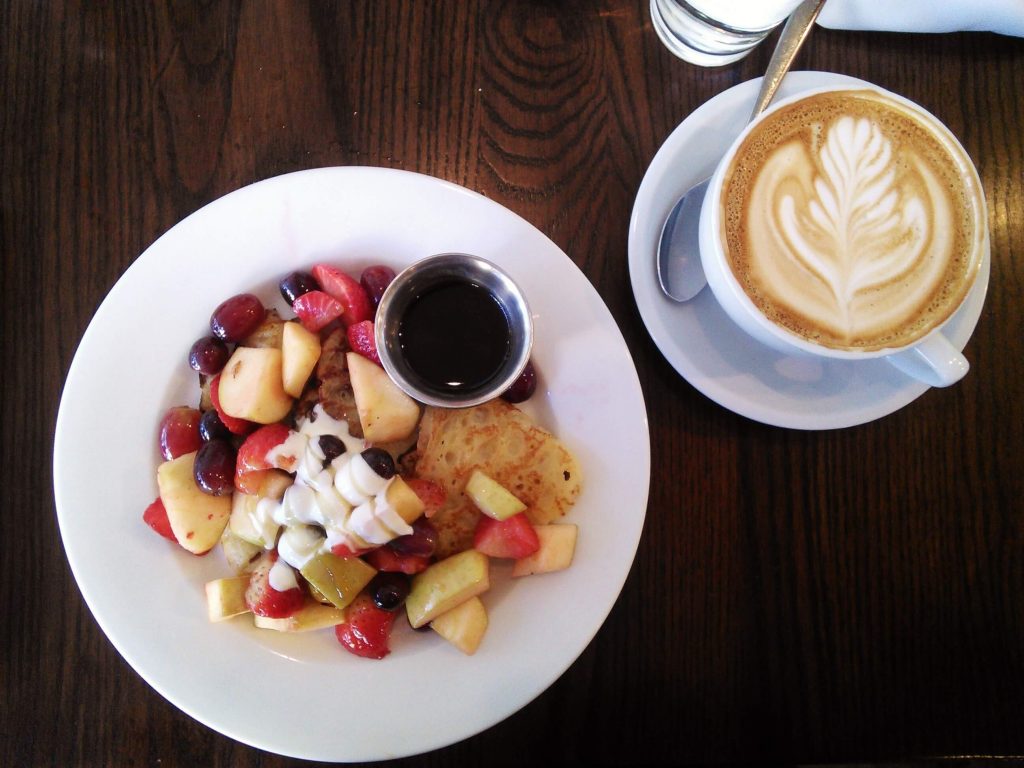The Grove Cafe and Market offers pancakes with a crepe-like texture, topped with whipped cream, maple syrup, and tons of seasonal fruit. Photo by Veronica Munoz/NMNP