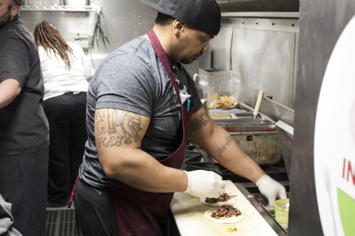 SFI student Fred Dotson prepares Korean BBQ tacos while the food truck was parked at Marble Brewery on Wednesday, March 9, 2016. Dotson wants to start a pastry food truck once he graduates from the program. Photo by John Acosta / NM News Port.