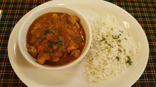 The Swahili chicken curry stew served with coconut basmati rice is a signature menu item at Karibu Café. Photo by Alicia Padilla / NM News Port. 