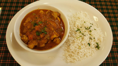 The Swahili chicken curry stew served with coconut basmati rice is a signature menu item at Karibu Café. Photo by Alicia Padilla / NM News Port.