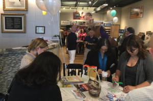 Members of the Albuquerque Hispano Chamber of Commerce sign into the Biz Gratis event. The event was held at Ray's Carpet One Floor & Home, located at 7441 Paseo Del Norte NE Suite 6 in Albuquerque, New Mexico. Photo by John Acosta / NM News Port