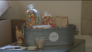 Different portions of popcorn displayed inside the Cornivore distribution center. The Cornivore uses a wholesale model selling its product. (Marino Spencer / NM News Port)