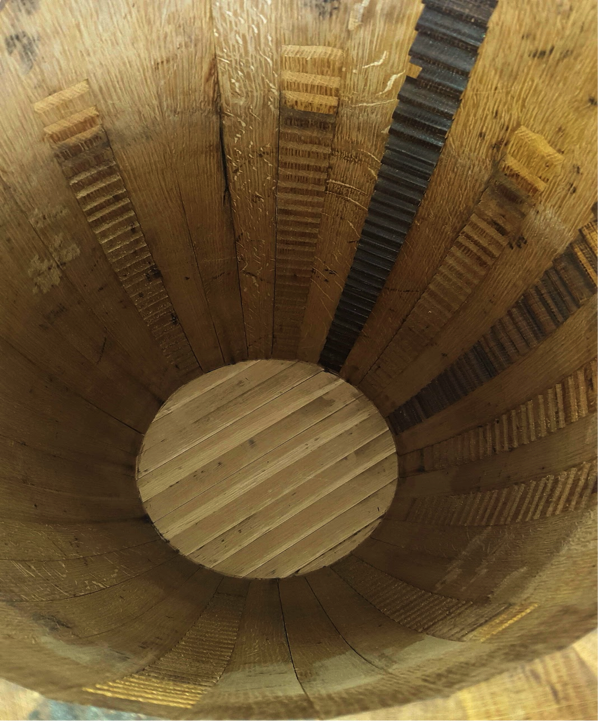The inside of a finished American white oak barrel shows the individual cuts and grooves made by Mahad Ahmed, head cooper of D.R. Cooperage and Grain. Photo by Alicia Padilla / NM News Port.