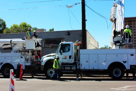 City workers doing construction work right outside of a local business, near Central and 10th.