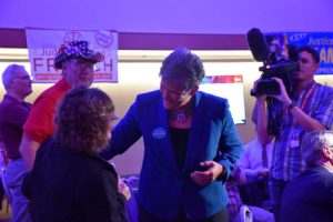 Nakamura talks with excited Republican attendees while waiting for the results of the race. (Photo taken by Allison Giron)