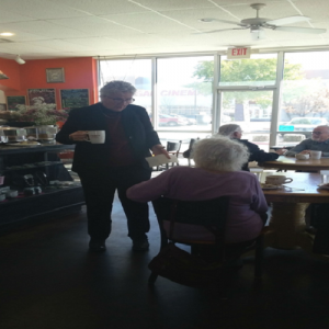 Liz Stefanics speaks with Santa Fe local at Tribes Coffee House before sitting down for breakfast and an interview with NM Newsport.