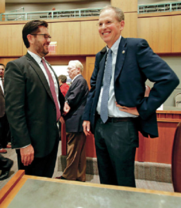 Rep Brian Egolf, left, talks to Sen. Peter Wirth, right, shortly after the special legislative session in October. Both men are up for house leadership positions.