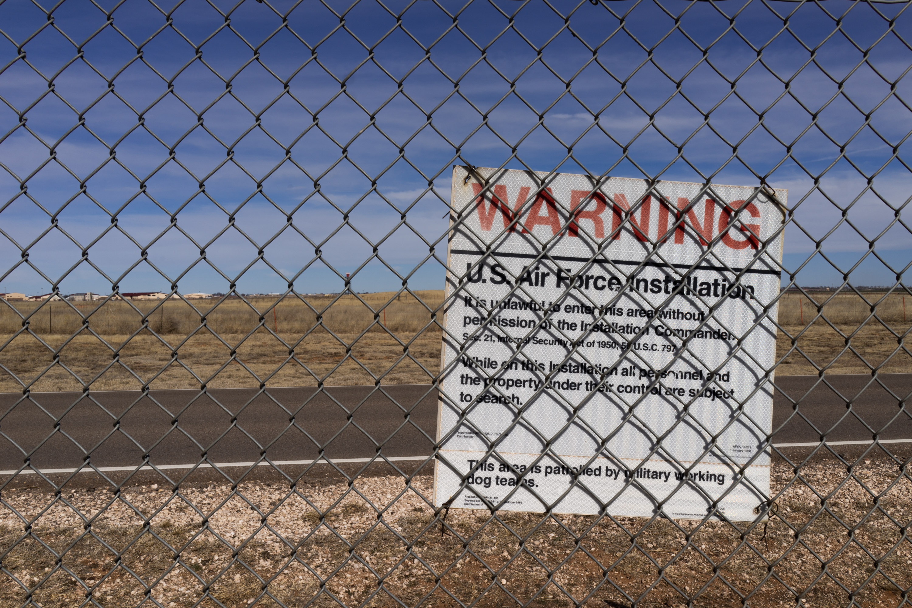 warning sign on the Canon Air Force Base fence, bordering the Highland